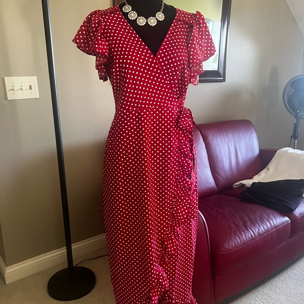 Red polkadot wrap dress. 100% polyester. Size 4/6. Approx 52” long.